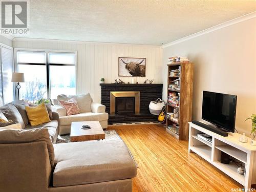 19 Logan Crescent E, Yorkton, SK - Indoor Photo Showing Living Room With Fireplace