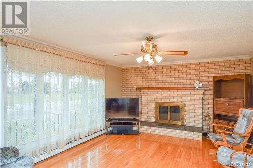 560 Saulnier Ouest Street, Tracadie, NB - Indoor Photo Showing Living Room With Fireplace