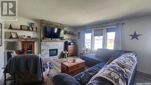 565 Alberta Street, Melville, SK - Indoor Photo Showing Living Room With Fireplace