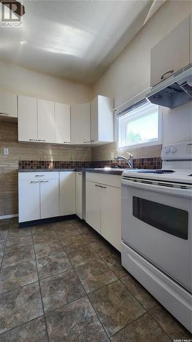 135 6Th Avenue W, Melville, SK - Indoor Photo Showing Kitchen With Double Sink