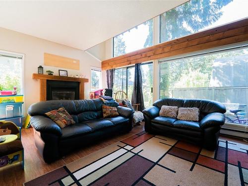 6174 Metral Dr, Nanaimo, BC - Indoor Photo Showing Living Room With Fireplace