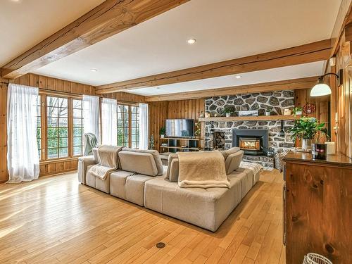 Living room - 265 Ch. De La Montagne, Piedmont, QC - Indoor Photo Showing Living Room With Fireplace