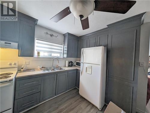 31-33 Rue Du Portage, Caraquet, NB - Indoor Photo Showing Kitchen With Double Sink