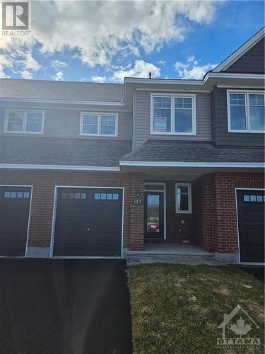 one of the Production Home Builder of the Year 2023 newest townhome designs.  Actual property is shown in exterior photos, while internal photos are from a model home at another location. - 157 Nepeta Crescent, Ottawa, ON - Outdoor