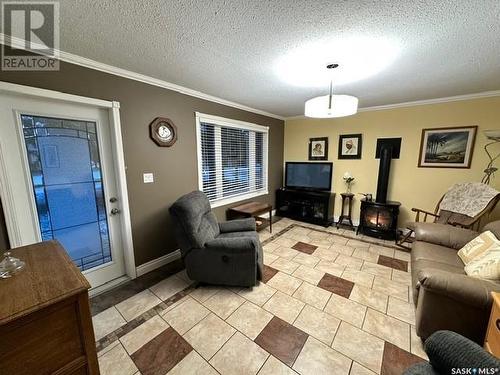 103 Lemieux Crescent, Leoville, SK - Indoor Photo Showing Living Room With Fireplace