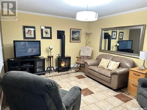 103 Lemieux Crescent, Leoville, SK - Indoor Photo Showing Living Room With Fireplace