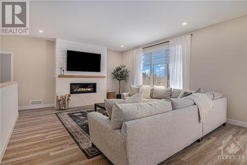 *NOT THE HOME FOR SALE - SAME MODEL PREVIOUSLY BUILT BY BUILDER* - 170 Danika Street, Hammond, ON - Indoor Photo Showing Living Room With Fireplace