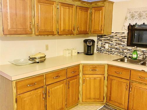 11 Ash Street, Ear Falls, ON - Indoor Photo Showing Kitchen With Double Sink