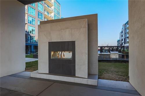 16 Concord Place|Unit #527, Grimsby, ON - Indoor With Fireplace