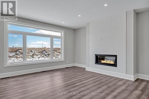 7 Nipigon Street, Kawartha Lakes, ON - Indoor Photo Showing Living Room With Fireplace