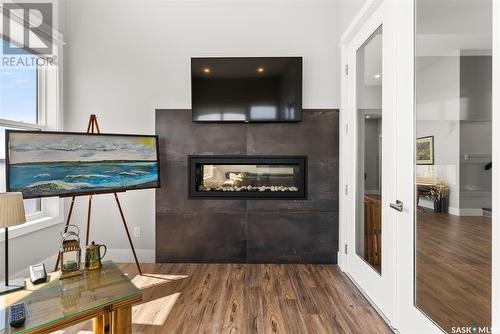 332 Mihr Bay, Sun Dale, SK - Indoor With Fireplace