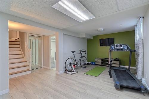 Salle d'exercice - 925 Rue Des Tulipes, La Prairie, QC - Indoor Photo Showing Gym Room