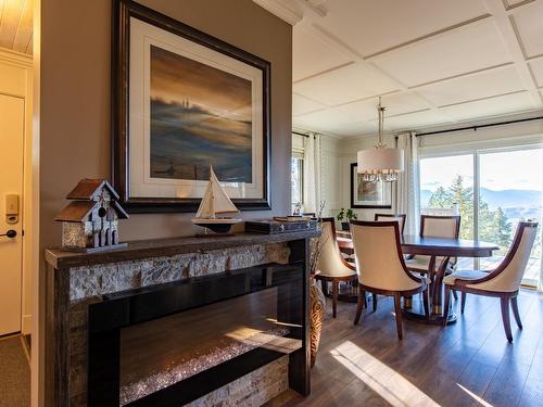 205 Peregrine Court, Osoyoos, BC - Indoor Photo Showing Dining Room With Fireplace
