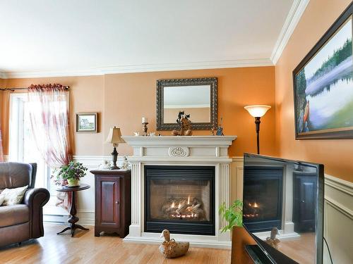 Salon - 256 Mtée Sanche, Rosemère, QC - Indoor Photo Showing Living Room With Fireplace