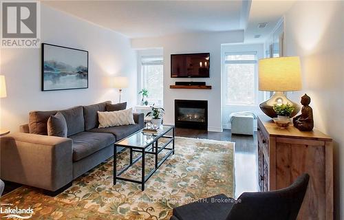 #207 -4 Brandy Lane, Collingwood, ON - Indoor Photo Showing Living Room With Fireplace