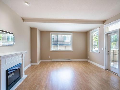 101-193 Second Ave West, Qualicum Beach, BC - Indoor Photo Showing Other Room With Fireplace