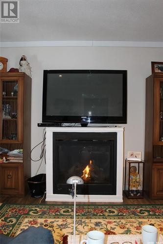107 4Th Avenue E, Climax, SK - Indoor Photo Showing Living Room With Fireplace