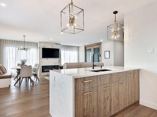 Kitchen - 134-195 Boul. Seigneurial O., Saint-Bruno-De-Montarville, QC - Indoor With Fireplace