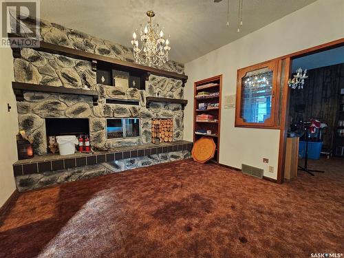 107 Centre Street, Kincaid, SK - Indoor Photo Showing Other Room With Fireplace