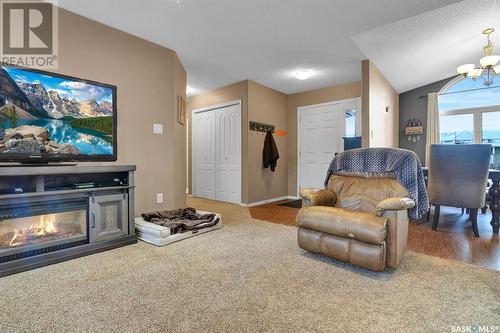 668 Riche Street, Bethune, SK - Indoor Photo Showing Living Room With Fireplace
