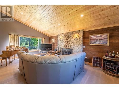 1732 Oberg Johnson Road, Golden, BC - Indoor Photo Showing Living Room With Fireplace