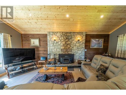 1732 Oberg Johnson Road, Golden, BC - Indoor Photo Showing Living Room With Fireplace