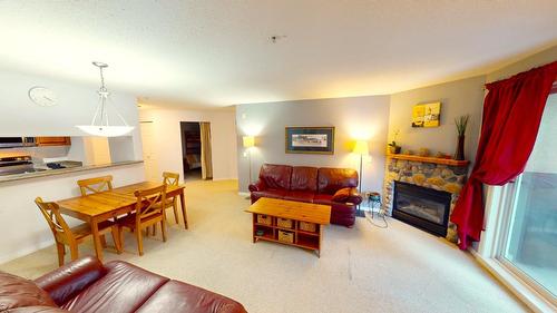212 - 4767 Forsters Landing Road, Radium Hot Springs, BC - Indoor Photo Showing Living Room With Fireplace