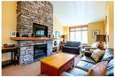 101C - 45 Rivermont Place, Fernie, BC  - Indoor Photo Showing Living Room With Fireplace 