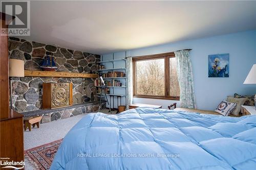 123 Maple Lane, Blue Mountains, ON - Indoor Photo Showing Bedroom With Fireplace