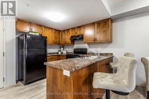 #206 -67 Kingsbury Sq, Guelph, ON - Indoor Photo Showing Kitchen With Double Sink