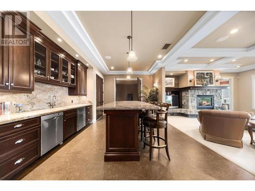 225 Swick Road, Kelowna, BC - Indoor Photo Showing Kitchen With Fireplace With Upgraded Kitchen