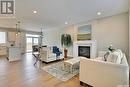 418 Hillside Crescent, Pilot Butte, SK  - Indoor Photo Showing Living Room With Fireplace 