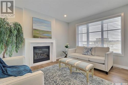 418 Hillside Crescent, Pilot Butte, SK - Indoor Photo Showing Living Room With Fireplace