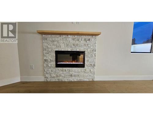 217 Elm Avenue Unit# 301, Penticton, BC - Indoor Photo Showing Living Room With Fireplace