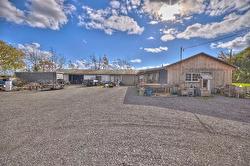 Shop on the right and behind is a 10 bay storage building. - 