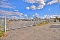 New chain link fencing and gate in storage compound. - 