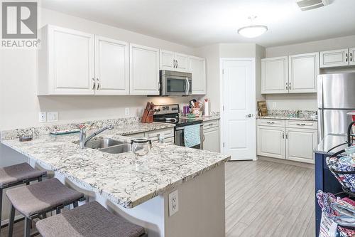 209 100 Chaparral Boulevard, Martensville, SK - Indoor Photo Showing Kitchen With Stainless Steel Kitchen With Double Sink