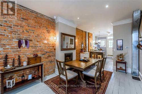 167 James St N, Hamilton, ON - Indoor Photo Showing Dining Room With Fireplace