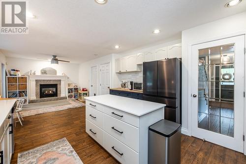 7562 Southridge Avenue, Prince George, BC - Indoor Photo Showing Kitchen With Fireplace