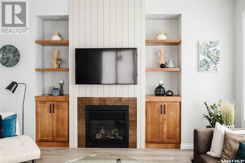 5201 Green Crescent, Regina, SK - Indoor Photo Showing Living Room With Fireplace