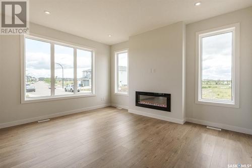 275 Prasad Manor, Saskatoon, SK - Indoor Photo Showing Living Room With Fireplace