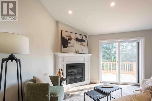 11 Clayton John Avenue, Brighton, ON - Indoor Photo Showing Living Room With Fireplace