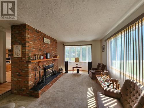 1500 West Fraser Road, Quesnel, BC - Indoor Photo Showing Living Room With Fireplace