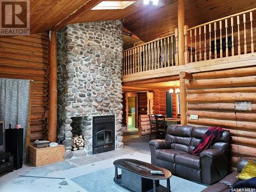 715 Chitek Drive, Chitek Lake, SK - Indoor Photo Showing Living Room With Fireplace