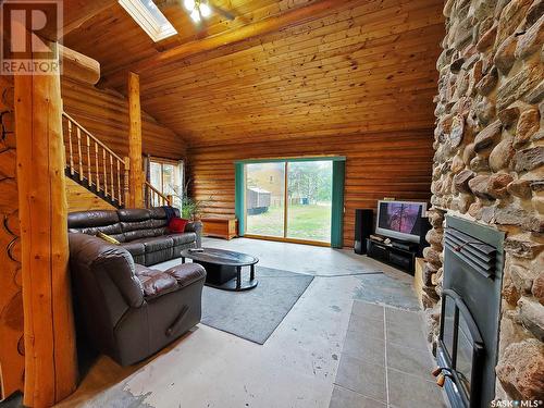715 Chitek Drive, Chitek Lake, SK - Indoor Photo Showing Living Room With Fireplace