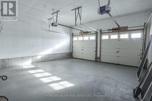 84 Alcorn Dr, Kawartha Lakes, ON - Indoor Photo Showing Garage