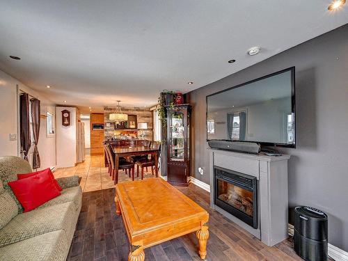 Overall view - 2 Rue Adrien, Saint-Paul, QC - Indoor Photo Showing Living Room With Fireplace