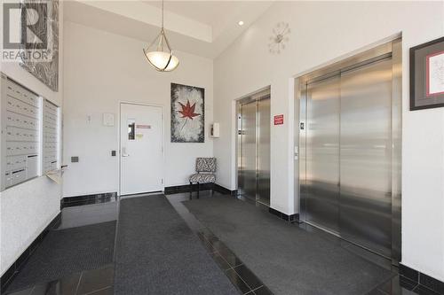 Entrance on main level with two elevators - 710 Cotton Mill Street Unit#206, Cornwall, ON - Indoor Photo Showing Other Room