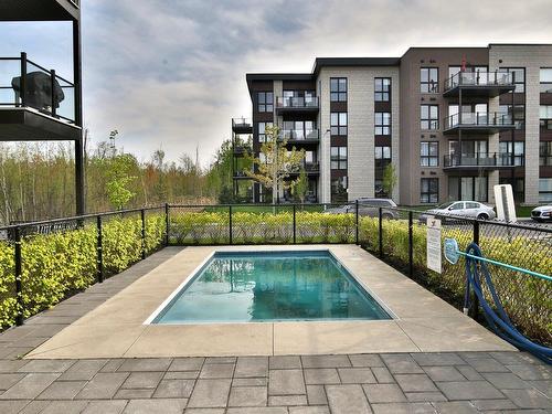 Piscine - 103-3630 Rue Roland-Marquette, Longueuil (Saint-Hubert), QC - Outdoor With In Ground Pool