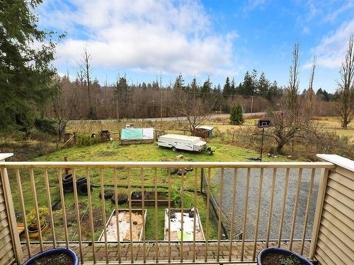 7522 Island Hwy North, Merville, BC - Outdoor With Balcony